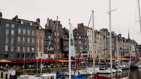 HONFLEUR, FRANCE - JULY 2014: City port and homes in summer season