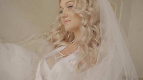 morning of the bride at the hotel. beautiful blonde.Sensual bride 
