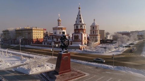 Russia, Irkutsk - January 20, 2021: Monument to the founders of Irkutsk Yakov Pokhabov on the banks of the Angara River. drone shooting. Winter weather, soaring water.