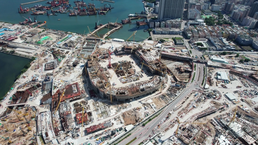 Aerial View of Hong Kong Kai Tak Waterfront Sports Stadium with sports facilities and Residential Commercial site, in Kowloon near Victoria Harbour | Shutterstock HD Video #1082893237