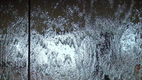 Water runs down the glass in slow motion 250fps