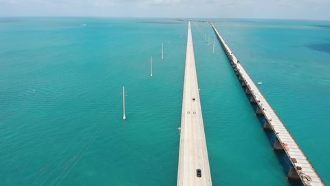 7 miles bridge, the longest bridge in the USA. Overseas highway Florida Keys. Cars driving on the bridge over the ocean US route 1. Old and new bridge stretching over the ocean,blue clear waters below