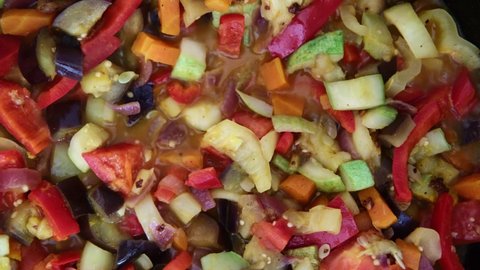Stew of various vegetables is stewed in a pan.