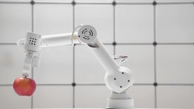Robot arm with red apple. robot hand is holding a red apple. Modern technology robotics concept. - Powered by Shutterstock - Get 15% off with code: PIKWIZARD15