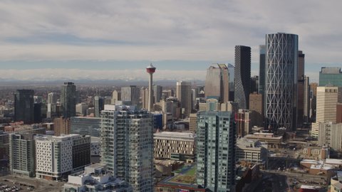 Aerial of Downtown Calgary Alberta with Rocky Mountains in the Background. 