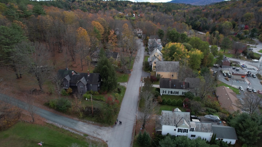 Aerial View of Sunapee, New Hampshire USA. Road and Residential Houses in Colors of Autumn, Drone Shot