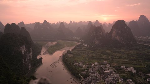 Li River And Karst Mountains With Pink Sunset In The Sky Near Yangshuo, Guilin, China. - timelapse