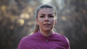Time-lapse video with close-up of a running girl's face. woman running in the woods in the morning.