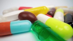 A macro shot of a collection of medicine pills and tablets with a crazy jittery glitching frame effect psychiatric  - Powered by Shutterstock - Get 15% off with code: PIKWIZARD15