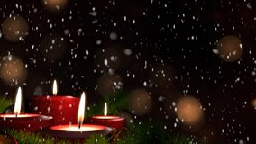 First Sunday of Advent - Beautiful snowfall in front of a Christmas decoration arrangement on a snowy table in front of a wooden background Advent, first Advent candle lit