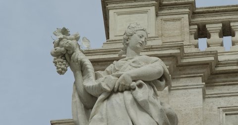 Allegorical sculpture on top of the columns of the Trevi Fountain in Rome, represent the positive effects of water on the fertility of the earth. Slow motio 50fps 4k