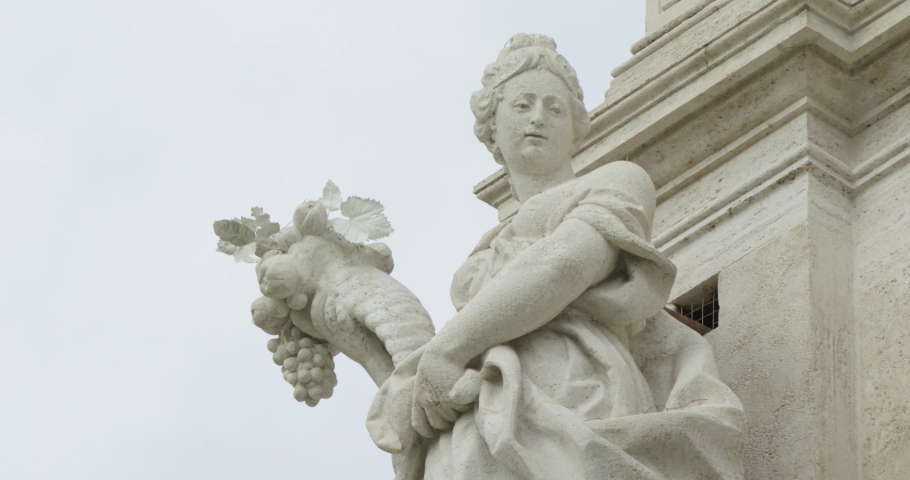 Allegorical sculpture on top of the columns of the Trevi Fountain in Rome, represent the positive effects of water on the fertility of the earth. Slow motio 50fps 4k