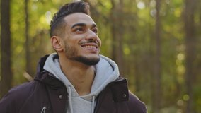Portrait handsome bearded hispanic guy travel video blogger in great nature. Happy smiling 30s man for cheerful selfie vlog in woods. Joyful male vlogger looking at cam. Attractive face good mood