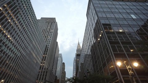 NEW YORK CITY, USA - OCT 21, 2021: Classical New York City Manhattan street drone low angle shot. 4k slow motion. NYC business offices and apartment buildings American modern urban life.  