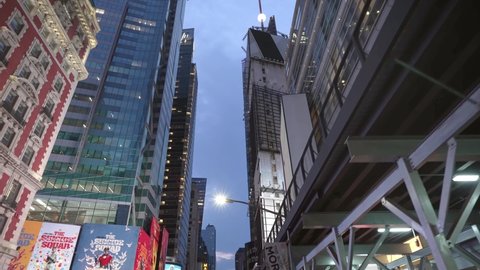 NEW YORK CITY, USA - OCT 21, 2021: Low angle aerial drone view Time Square busy street in Manhattan, New York City. NYC is urban center, modern business city in USA, iconic landmark of America 4k  