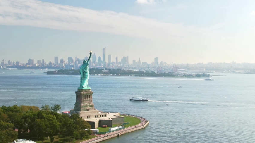 Aerial views of the Statue of Liberty. Colossal sculpture on Liberty island. Harbor in New York, in the United States. Travel destination and popular tourist city in America.
