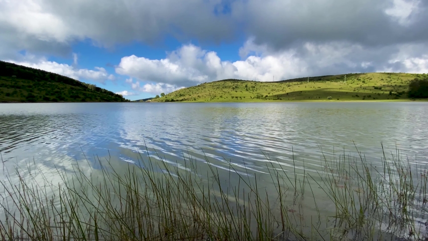Shooting of the Cartolari lakes on the Nebrodi mountains in spring. View of Mount Etna in spring, Sicily, Italy. Aquatic animals in the Sicilian mountains. Lake Trearie. Liperni lake.