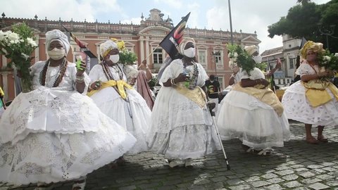 salvador, bahia, brazil - november 20, 2021: Candomble members and black entities participate in washing the statue of black leader Zumbi dos Palmares in the Historic Center of the city of Salvador.