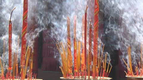 Zoom Wide Shot of burning Incense in brazier at the Thien Hau Thanh Mau Temple in Ho Chi Minh City, Vietnam