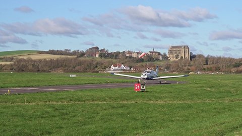 Shoreham, West Sussex, UK, November 21, 2021. A 1978 Piper PA 28 161 Cherokee Warrior II G-FTAB arriving at Brighton City Airport with Lancing College and the South Downs in the background.