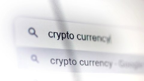 Buenos Aires, Argentina - March 2021: Searching for "Crypto Currency" on Computer. Close Up. 4K Resolution.