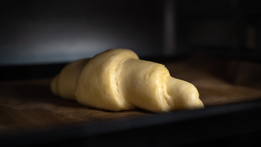 Croissants baking timelapse. One hand made croissants cooking Royalty-Free Stock Footage #1083011458