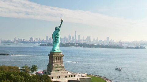 Aerial Statue of Liberty NYC, drone view Manhattan downtown New York city. Travel destination and popular tourist city in America. Historic Liberty island.