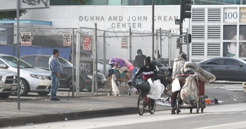 Los Angeles, CA USA - November 23, 2021: Homeless people and tents on the streets of Skid Row in Los Angeles