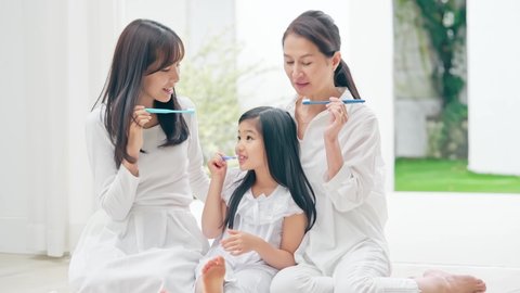 Asian three generation female family brushing their teeth. Dental care. Oral care.