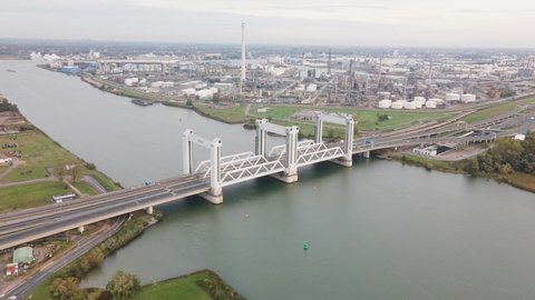 Botlekbrug aerial hyperlapse lifting bridge for road and rail traffic over the Oude Maas in the Rotterdam port area. Dutch infrastructure.