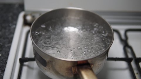 Pot Boiling Water On Stove Rapid Stock Footage Video (100% Royalty