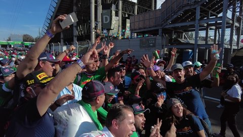 Ciudad de Mexico , CDMX , Mexico - 11 07 2021: Group of Mexican fans spectators celebrating cheering the podium of Sergio Checo Perez at the F1 GP Grand Prix in Mexico City