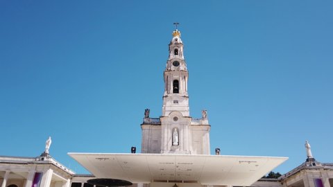Fatima, Portugal, August 21, 2021: TILT SHOT - The Basilica of Our Lady of the Rosary of Fatima stands at the place where the three shepherds were playing by "building a small wall" on May 13, 1917.