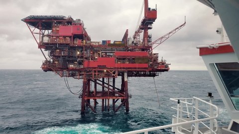 Platform supply vessel PSV near Oil Rig and drilling platform