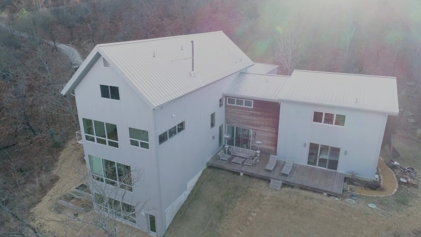 4-story contemporary modern sustainable house design built in the woods.