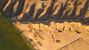 Drone flies over incised meander of the river in the clay mountains. Grand canyon Stanislav, Dnieper Bay near Black sea, Ukraine, Europe. Cinematic aerial shot. Beauty of earth. Filmed in 4k video.