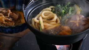 Sukiyaki. A video of eating udon with raw eggs.