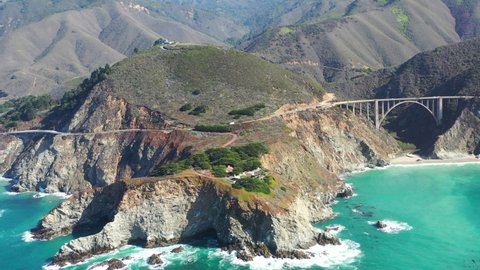 The Pacific Ocean washes onto the beautiful seashore of California, not far south of Monterey. The Pacific Coast Highway runs over the Bixby Bridge and right along this incredibly scenic coast.