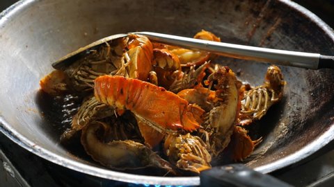 Stir fry flathead lobster or slipper lobster.