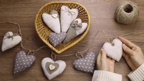 The heart is made of cotton fabric. Valentine's day.The concept of decor, sewing,needlework. Handmade for valentine's day or mother's day.Valentine background with sewed pillow diy handmade hearts  - Powered by Shutterstock - Get 15% off with code: PIKWIZARD15