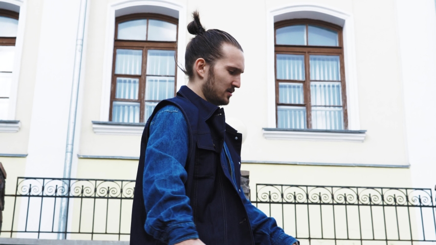 dancing man young mixed race street dancer performing freestyle hip hop moves enjoying modern dance expression practicing on the street