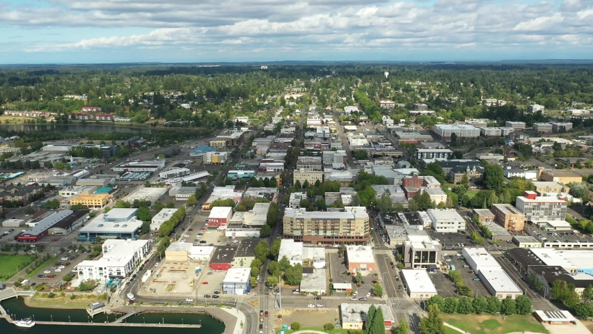 Cinematic 4K aerial drone dolly shot of the Olympia Yacht Club near the Washington State Capitol Building and Campus, Capitol Lake, with a panoramic view of Historic District in Olympia, Washington