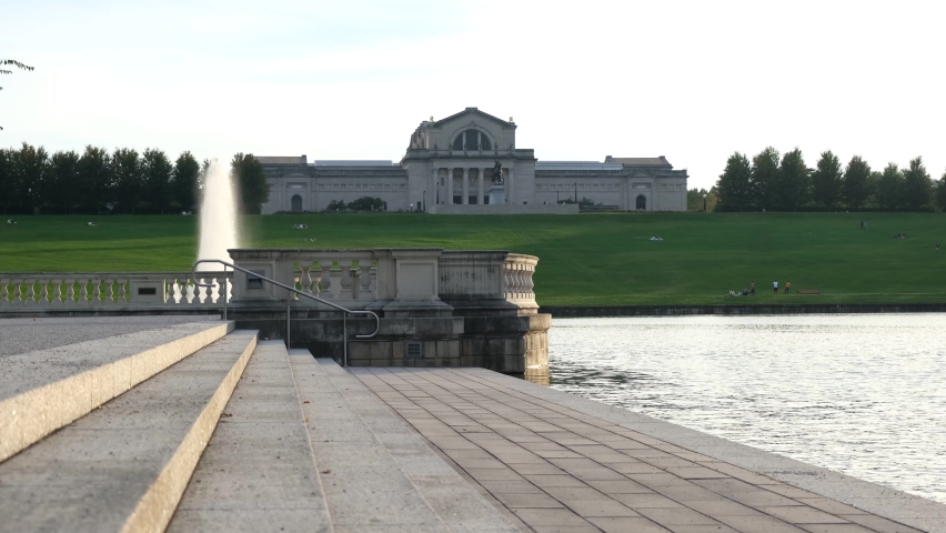 Walking trough the left sidewalk of the pond at Forest Park, St. Louis, MO