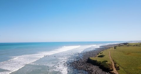 Aerial over Cape Egmont rural coastline on a bright sunny day - Taranaki NZ
