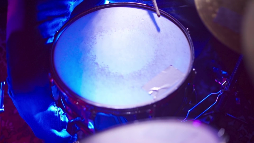 The drummer hits the snare drum with sticks | Shutterstock HD Video #1083118600
