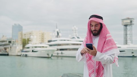 Arab male meeting with female entrepreneur in harbor