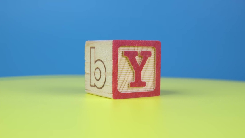 Close up shot letter "Y" alphabet wooden block on surface