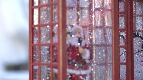 4k, closeup, Santa Claus who calls in a snowball or a public phone