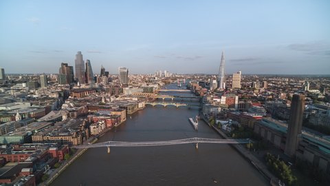 London, United Kingdom - circa 2021 -  Establishing Aerial View Shot of London UK, United Kingdom, push into the city, wonderful  afternoon, riverside and skyscrapers