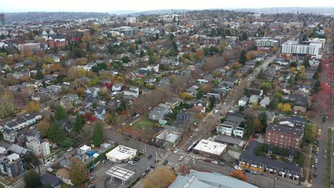Cinematic 4K aerial drone 360 shot of Capitol Hill, Pike Pine, First Hill, Central district, Seattle University, Cherry Hill, Squire Park, Minor, Cal Anderson Park around downtown Seattle, Washington